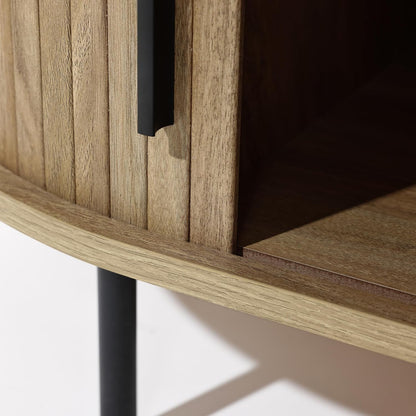 Mid-century modern coffee table with tambour sliding doors, featuring a warm oak grain finish and sleek, compact design. Ideal for storage and stylish living room decor.