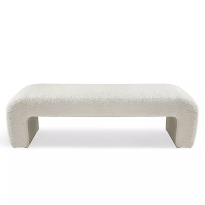 Luxurious cream bouclé ottoman with plush foam cushioning, versatile storage, and sleek sled legs, perfect for enhancing bedroom decor or any room. Premium construction, easy care, and a 500 lb weight capacity for ultimate comfort and style.