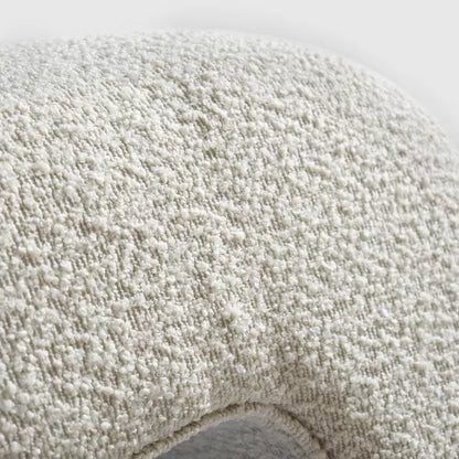 Luxurious cream bouclé ottoman with plush foam cushioning, versatile storage, and sleek sled legs, perfect for enhancing bedroom decor or any room. Premium construction, easy care, and a 500 lb weight capacity for ultimate comfort and style.