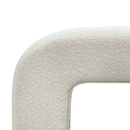 Luxurious cream bouclé ottoman with plush foam cushioning, versatile storage, and sleek sled legs, perfect for enhancing bedroom decor or any room. Premium construction, easy care, and a 500 lb weight capacity for ultimate comfort and style.