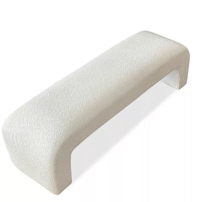 Luxurious cream bouclé ottoman with plush foam cushioning, versatile storage, and sleek sled legs, perfect for enhancing bedroom decor or any room. Premium construction, easy care, and a 500 lb weight capacity for ultimate comfort and style.