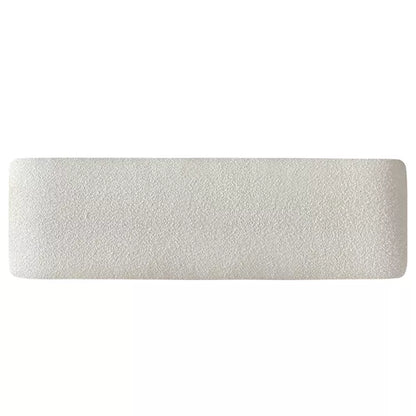 Luxurious cream bouclé ottoman with plush foam cushioning, versatile storage, and sleek sled legs, perfect for enhancing bedroom decor or any room. Premium construction, easy care, and a 500 lb weight capacity for ultimate comfort and style.