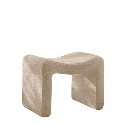 Modern camel-colored pedal stool with engineered wood frame, smooth lint and sherpa lining, versatile semicircular design, and compact size. Ideal as a footrest, extra seating, or accent piece for any room.