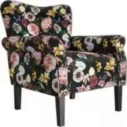  A Black Floral Wingback Accent Chair featuring a luxurious black fabric with intricate floral patterns, offering a modern-retro aesthetic. The chair has a tufted wingback design, wide cushioned seat, and padded armrests for ergonomic comfort. Supported by elegant tapered wood legs, it blends traditional charm with contemporary style. Ideal for a living room, office, or reading nook, this accent chair provides both comfort and sophistication.