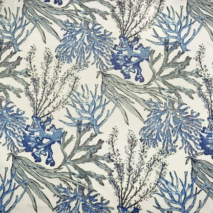 A stylish Blue Coral Accent Chair featuring a vibrant blue coral fabric with a unique pattern. The chair has a tufted wingback design, gracefully tapered wood legs, and padded armrests for optimal comfort. It combines modern sophistication with a classic aesthetic, ideal for any living room, office, or reading nook.