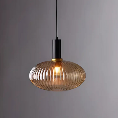 Modern amber pendant light with striped glass shade and black metal body, adjustable height chandelier for dining room, living room, and kitchen.