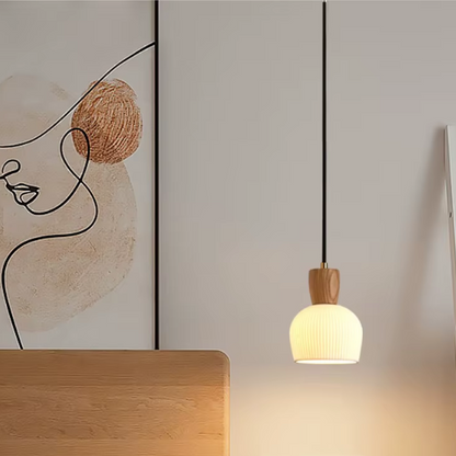 Ash wood pendant light with white ceramic shade for modern kitchen and living room decor.