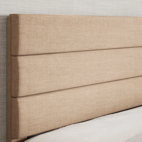 Beige upholstered queen platform bed with tufted headboard and no-box-spring slatted base