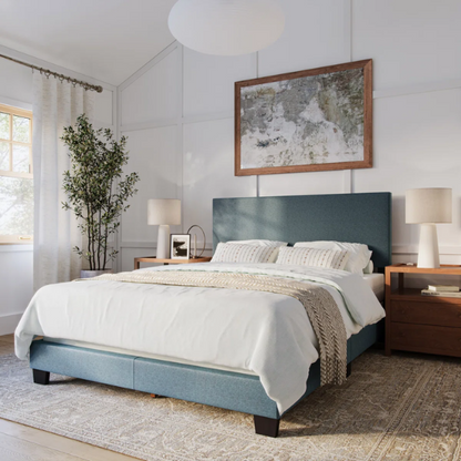 Blue polyester upholstered queen panel bed with tall foam-padded rectangular headboard and wood frame