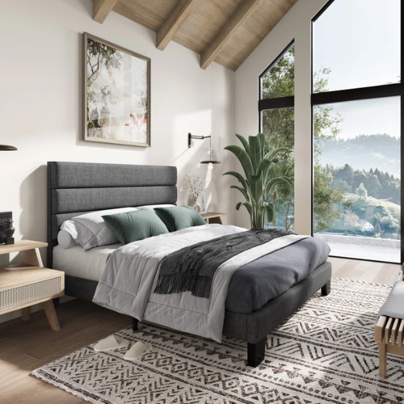 Dark grey upholstered queen platform bed with tufted headboard and wood slat support system