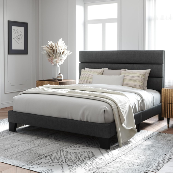 Dark grey upholstered queen platform bed with tufted headboard and wood slat support system