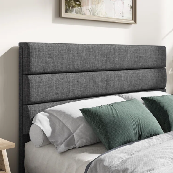 Dark grey upholstered queen platform bed with tufted headboard and wood slat support system