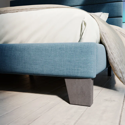 Deep blue upholstered queen platform bed with tufted headboard and slatted wood base, no box spring needed