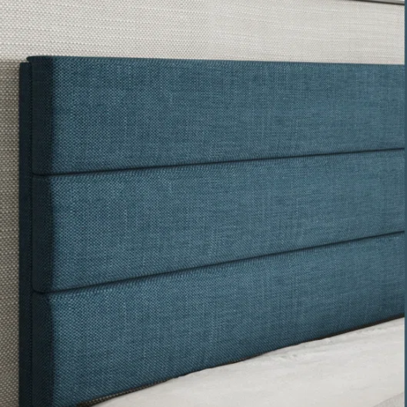 Deep blue upholstered queen platform bed with tufted headboard and slatted wood base, no box spring needed