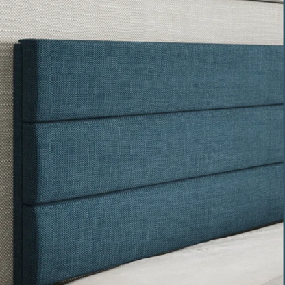 Deep blue upholstered queen platform bed with tufted headboard and slatted wood base, no box spring needed