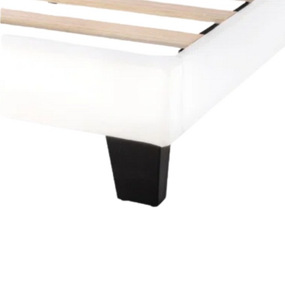 White upholstered queen platform bed with tufted headboard and wood slat base, no box spring required