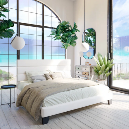 White upholstered queen platform bed with tufted headboard and wood slat base, no box spring required