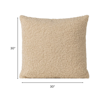 Beige bouclé throw pillow with looped textured fabric, square accent pillow on a neutral-toned sofa

