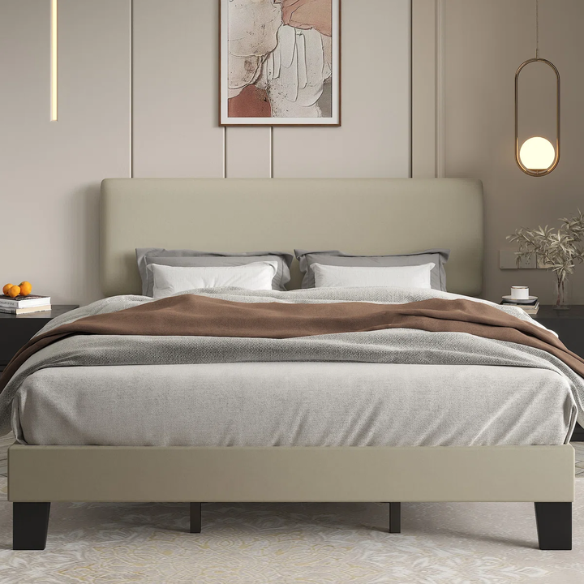 Beige king-size upholstered platform bed with adjustable linen headboard, underbed storage clearance, and padded frame for modern bedroom décor

