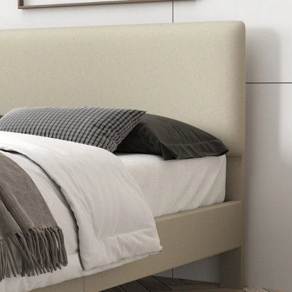 Beige king-size upholstered platform bed with adjustable linen headboard, underbed storage clearance, and padded frame for modern bedroom décor

