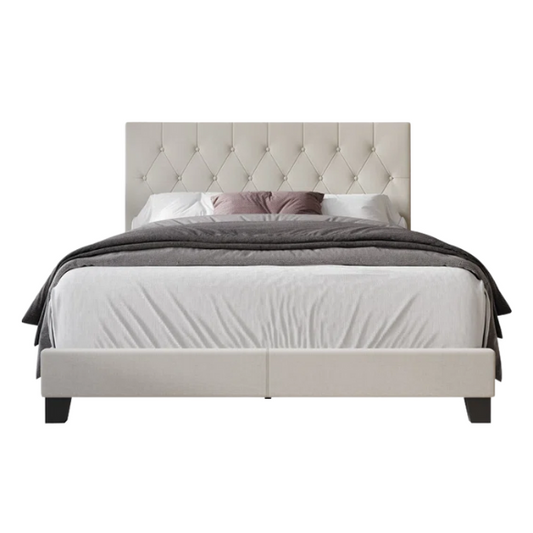 Beige linen full size upholstered bed with button tufted headboard and low-profile legs