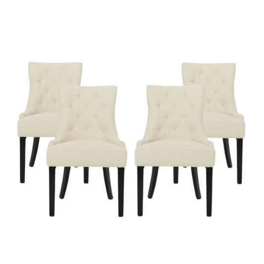 Set of four beige upholstered dining chairs featuring diamond tufting, armless design, sloped sides, and espresso brown wooden legs.