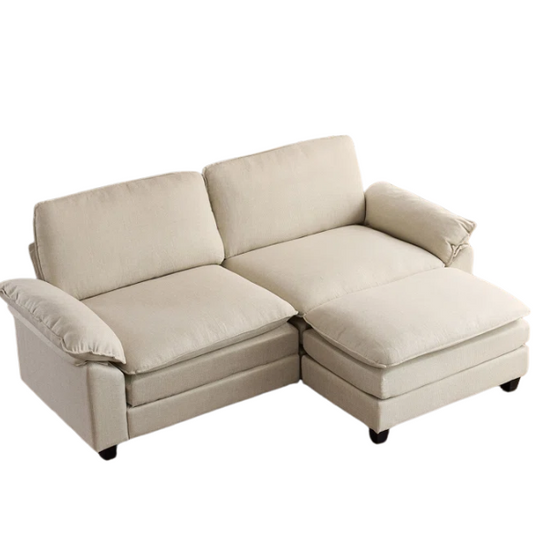 Beige modular cloud sofa with pillow top arms, deep foam cushions, and matching ottoman