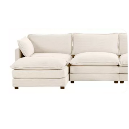 Beige three-seater modular corduroy sectional sofa with movable ottoman, modern L-shaped couch for living room, featuring plush cushions and durable wood-metal frame.