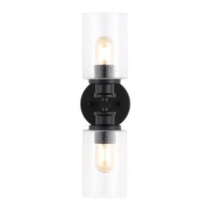 Art Deco-style black wall sconce with dual clear seeded glass cylinder shades and Edison-style LED bulbs, suitable for bathroom or hallway lighting

