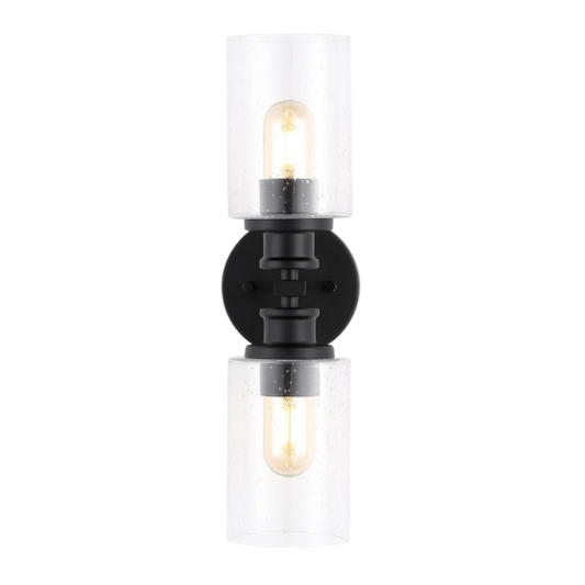 Art Deco-style black wall sconce with dual clear seeded glass cylinder shades and Edison-style LED bulbs, suitable for bathroom or hallway lighting

