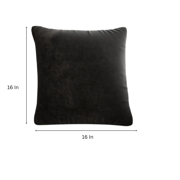 Black crushed velvet throw pillow, 16x16 square with soft texture and reversible design, styled on a modern sofa for elegant, cozy home decor.

