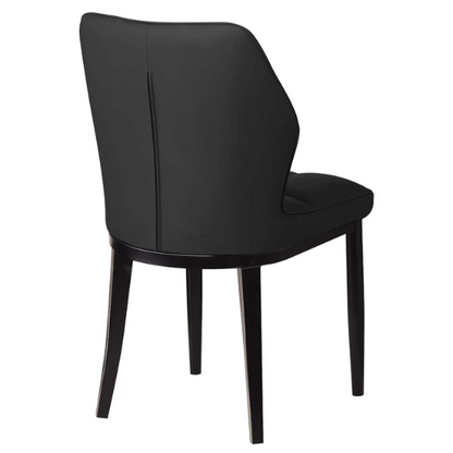 Set of two mid-century modern black faux leather dining chairs with checkered stitching and metal legs