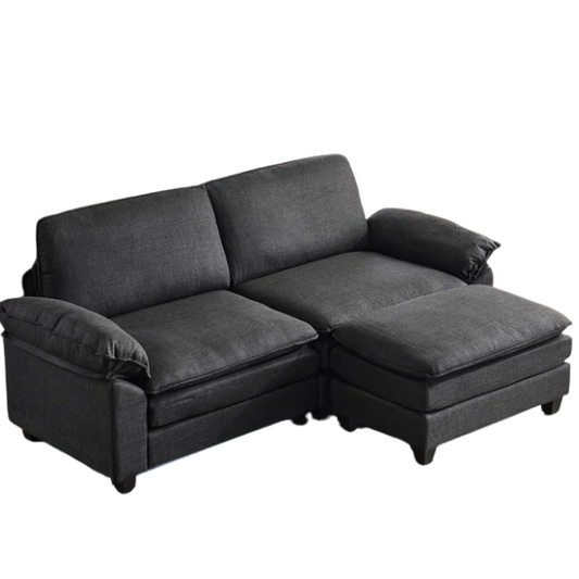 Black modular cloud sofa with deep foam cushions, pillow top arms, and matching ottoman