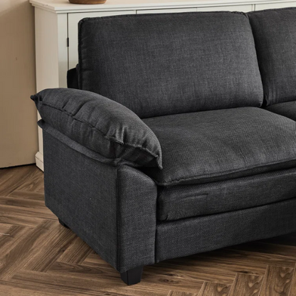 Black modular cloud sofa with deep foam cushions, pillow top arms, and matching ottoman
