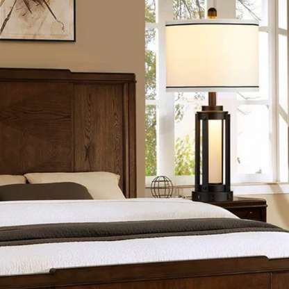 Set of two 25.3-inch modern black table lamps featuring white drum shades with black trim, built-in nightlight, USB and Type-C charging ports, and AC outlet on each base.

