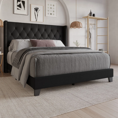 Black upholstered full-size bed with tufted wingback headboard and nailhead trim
