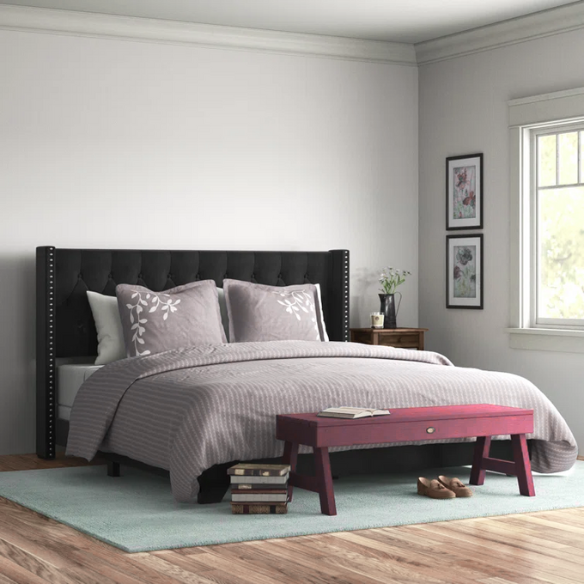 Black velvet full size bed with button-tufted wingback headboard, nailhead trim, and low-profile frame.