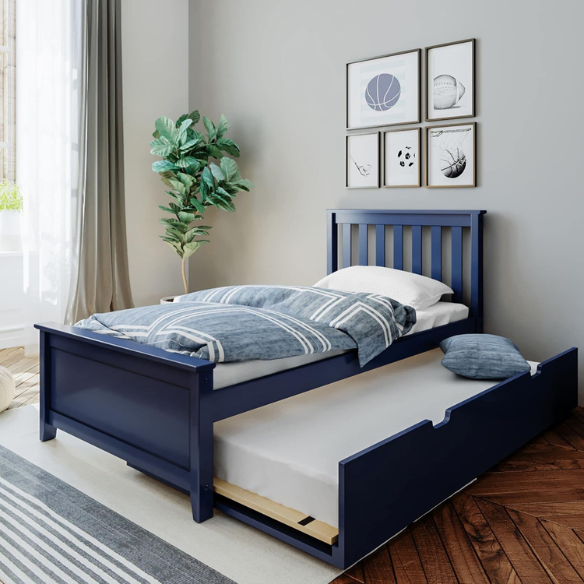 Blue solid wood twin bed with a slatted headboard and a pull-out trundle featuring caster wheels and a cut-out handle, ideal for kids or guest use.

