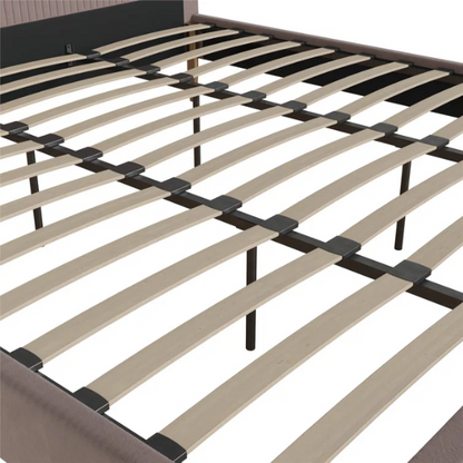 Blush pink velvet upholstered king-size platform bed with padded rectangular headboard, solid wood slats, and elegant low-profile frame.

