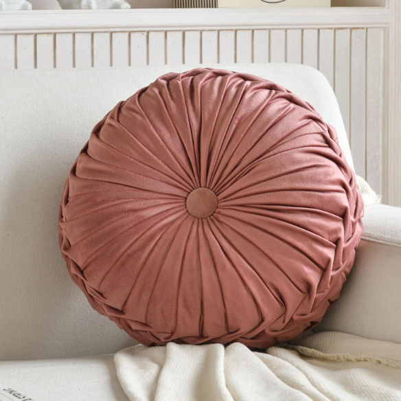 Blush velvet round throw pillow with ribbed edges and button detail, soft cotton fill for home décor