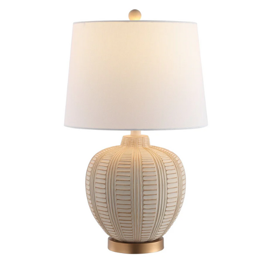 Cream and rose gold resin table lamp with carved textured base, white cotton drum shade, and built-in USB charging port for modern boho interiors

