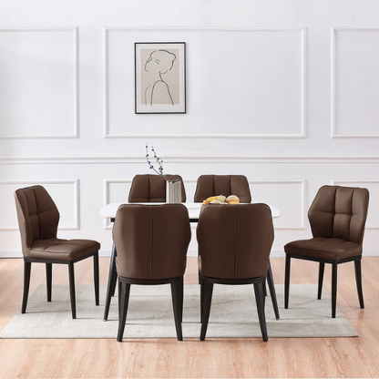 Set of two brown mid-century modern faux leather dining chairs with checkered stitching and metal legs