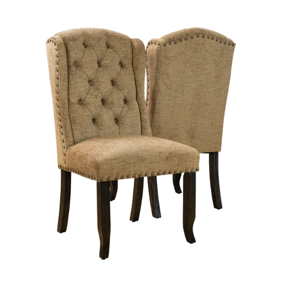 Set of two brown gold wingback dining chairs with tufted backs, nailhead trim, and espresso-finished legs, perfect for farmhouse or traditional dining spaces.