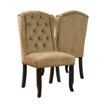 Set of two brown gold wingback dining chairs with tufted backs, nailhead trim, and espresso-finished legs, perfect for farmhouse or traditional dining spaces.