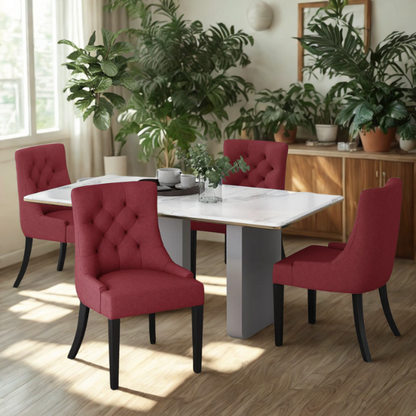 Set of four burgundy upholstered dining chairs featuring diamond tufted backs, armless design, sloped arms, and espresso brown wooden legs.

