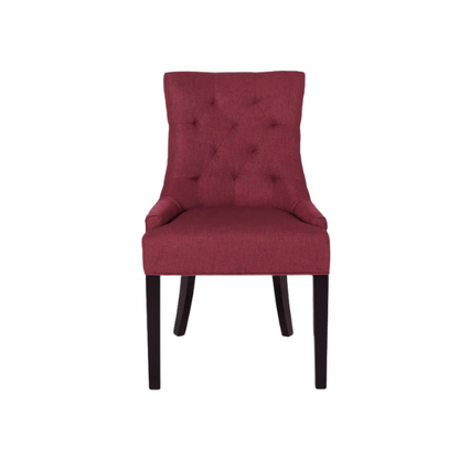 Set of four burgundy upholstered dining chairs featuring diamond tufted backs, armless design, sloped arms, and espresso brown wooden legs.

