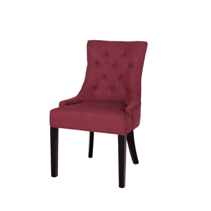 Set of four burgundy upholstered dining chairs featuring diamond tufted backs, armless design, sloped arms, and espresso brown wooden legs.

