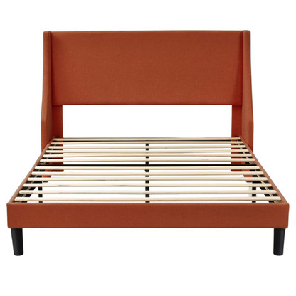 Burnt orange upholstered queen platform bed with wingback headboard, tapered legs, and slatted base – no box spring required

