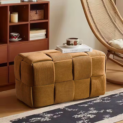 Burnt orange velvet ottoman with engineered wood frame, modern design, and square woven shape