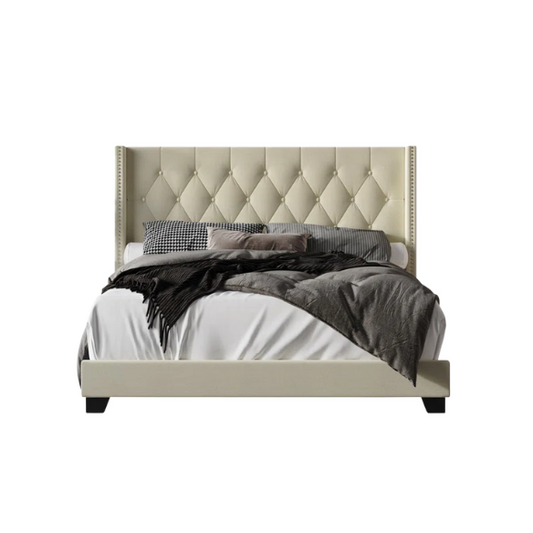 Buttercup yellow linen full size upholstered bed with button-tufted wingback headboard, nailhead trim, and low-profile frame."